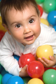 Baby playing ball pool